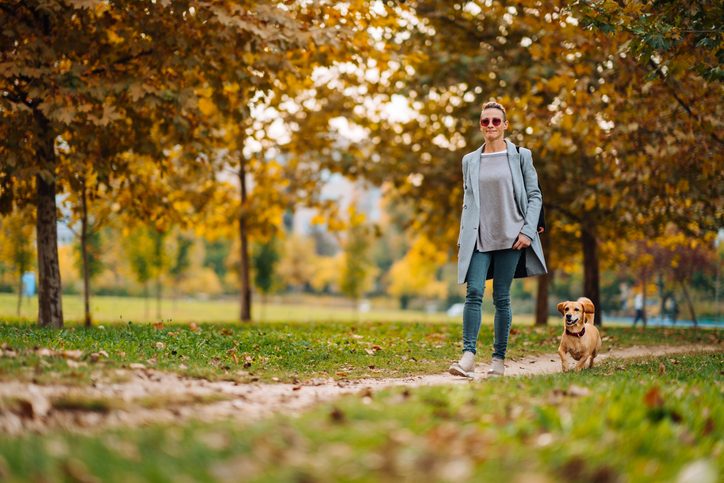 woman walking with her dog