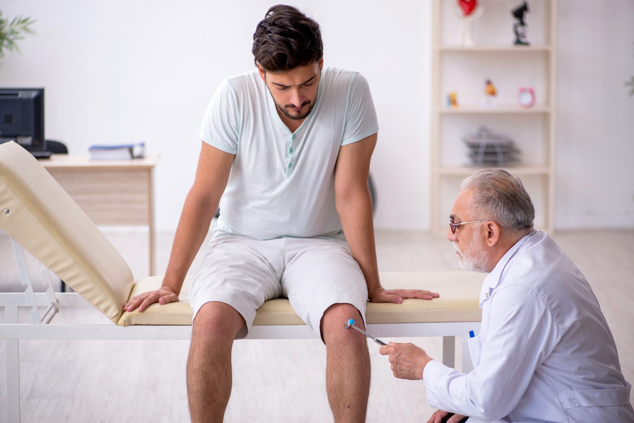 a doctor examines a man